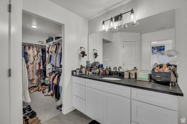 12357 S Eovaldi Ave, Herriman, UT 84096 - bathroom with vanity and a spacious closet