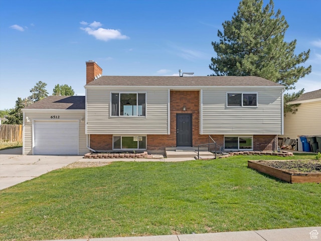 6512 W King Valley Rd S, West Valley City, UT 84128 - raised ranch featuring driveway, a garage, brick siding, and a chimney
