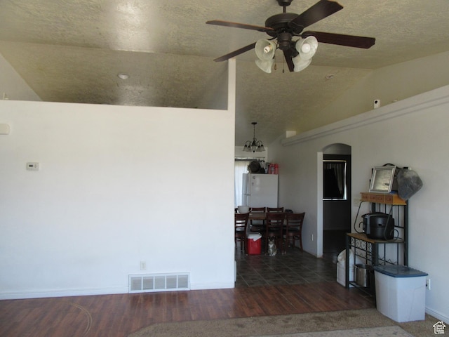 544 E 1875 S, Roosevelt, UT 84066 - unfurnished room with a ceiling fan, lofted ceiling, a textured ceiling, wood finished floors, and arched walkways