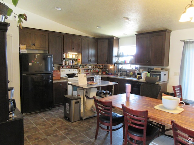 544 E 1875 S, Roosevelt, UT 84066 - kitchen with black appliances, dark brown cabinetry, vaulted ceiling, light countertops, and a center island