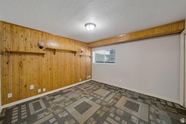 13155 S 3600 W, Riverton, UT 84065 - empty room with a textured ceiling, wood walls, and carpet flooring