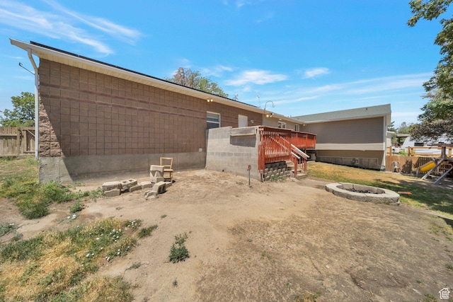 13155 S 3600 W, Riverton, UT 84065 - view of yard featuring a fire pit, a wooden deck, and stairs
