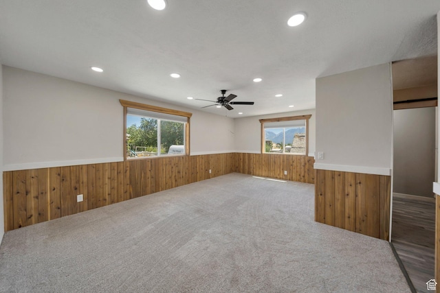 13155 S 3600 W, Riverton, UT 84065 - empty room with a wainscoted wall, wood walls, healthy amount of natural light, recessed lighting, and carpet floors