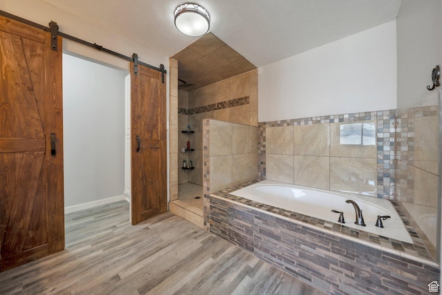 13155 S 3600 W, Riverton, UT 84065 - bathroom featuring a garden tub, walk in shower, and wood finished floors