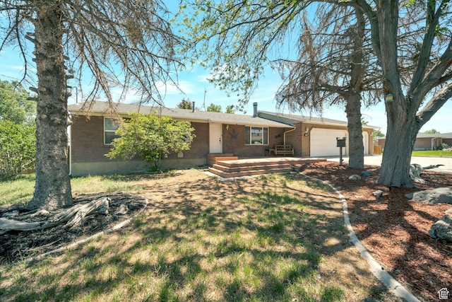 13155 S 3600 W, Riverton, UT 84065 - ranch-style house with brick siding, a garage, and concrete driveway