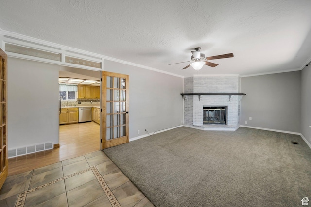 13155 S 3600 W, Riverton, UT 84065 - unfurnished living room with ceiling fan, light tile patterned floors, crown molding, a fireplace, and inlaid floor details
