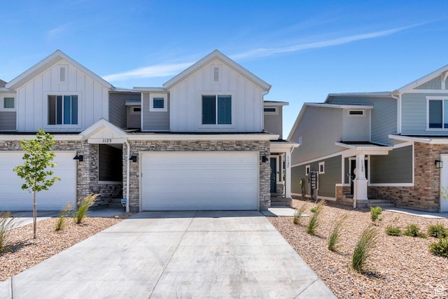 1127 W Hidden Spring Dr, Santaquin, UT 84655 - view of front facade with board and batten siding, an attached garage, driveway, and stone siding