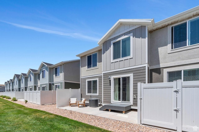 1127 W Hidden Spring Dr, Santaquin, UT 84655 - rear view of property with a gate, board and batten siding, a patio, and a residential view