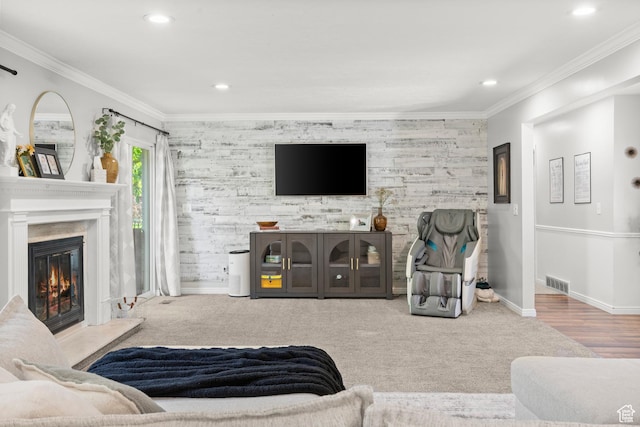 958 N Main St W, Farmington, UT 84025 - living room with an accent wall, a glass covered fireplace, recessed lighting, and ornamental molding