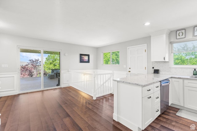 958 N Main St W, Farmington, UT 84025 - kitchen featuring stainless steel dishwasher, a peninsula, dark wood-style floors, white cabinetry, and light stone countertops
