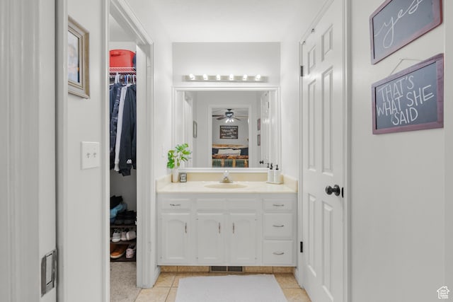 958 N Main St W, Farmington, UT 84025 - bathroom with vanity, a ceiling fan, a walk in closet, and tile patterned flooring
