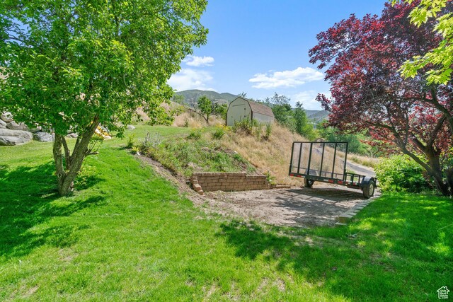 958 N Main St W, Farmington, UT 84025 - view of green lawn featuring a shed and a mountain view