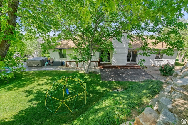 958 N Main St W, Farmington, UT 84025 - rear view of property with a patio, a hot tub, a yard, and brick siding