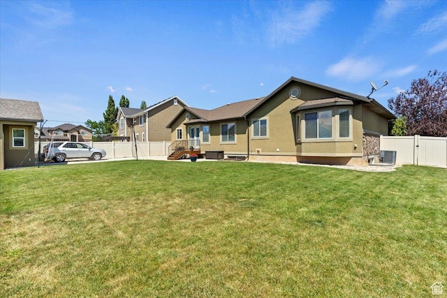 2876 S 1200 W, Syracuse, UT 84075 - rear view of property featuring stucco siding, a gate, and a fenced backyard