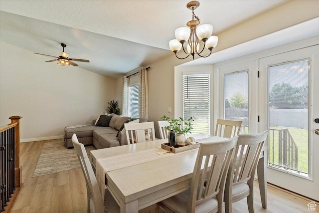 2876 S 1200 W, Syracuse, UT 84075 - dining space featuring light wood-type flooring, a chandelier, lofted ceiling, and ceiling fan