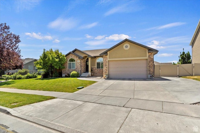 2876 S 1200 W, Syracuse, UT 84075 - view of front of house featuring a gate, concrete driveway, an attached garage, and stucco siding