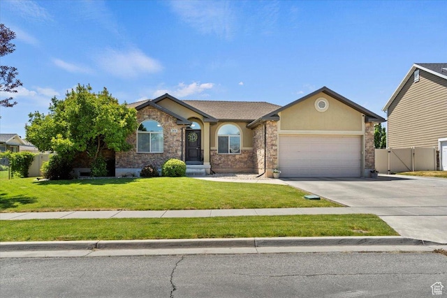 2876 S 1200 W, Syracuse, UT 84075 - single story home featuring an attached garage, concrete driveway, a gate, stucco siding, and stone siding