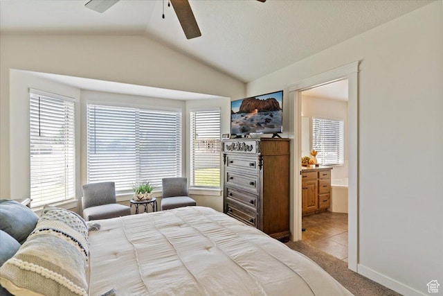2876 S 1200 W, Syracuse, UT 84075 - bedroom with vaulted ceiling, light colored carpet, ensuite bath, and a ceiling fan