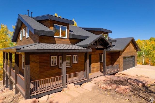 11301 E Marigold Ln Unit 1670, Heber City, UT 84032 - view of front of house with a porch, a standing seam roof, a metal roof, an attached garage, and roof with shingles