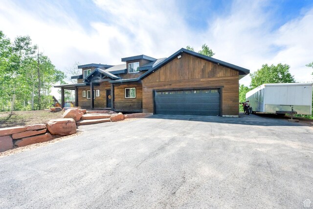 11301 E Marigold Ln Unit 1670, Heber City, UT 84032 - chalet / cabin featuring a garage and driveway
