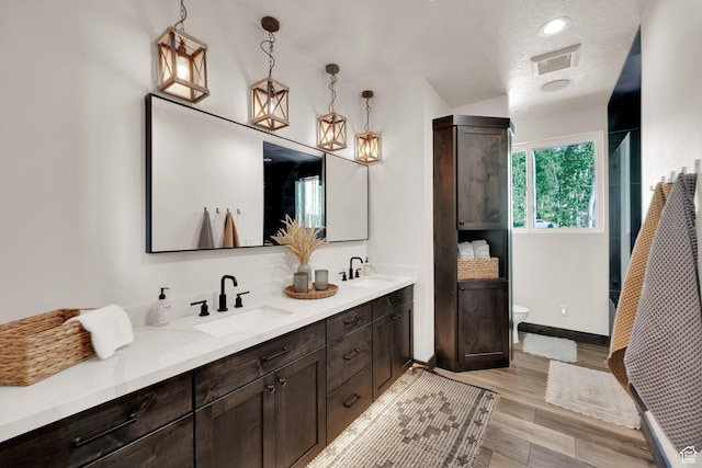 11301 E Marigold Ln Unit 1670, Heber City, UT 84032 - bathroom with double vanity, wood finished floors, and a shower with shower door