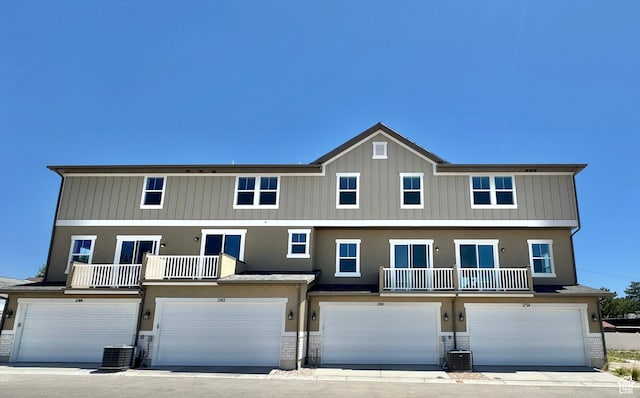 1650 N Main St N Unit 116, Layton, UT 84041 - view of front of home featuring a garage, a balcony, stone siding, and stucco siding