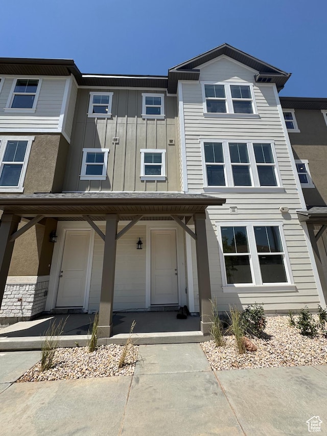 1650 N Main St N Unit 116, Layton, UT 84041 - townhome / multi-family property with board and batten siding and a porch