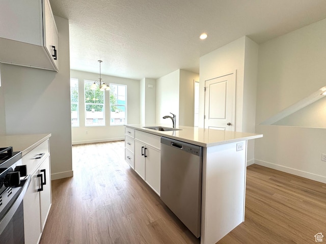 1650 N Main St N Unit 116, Layton, UT 84041 - kitchen with appliances with stainless steel finishes, light wood-style flooring, a chandelier, white cabinetry, and light countertops