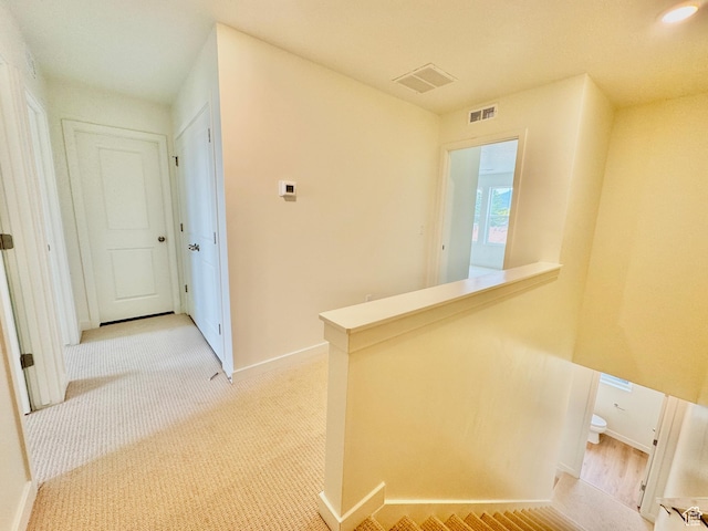 1650 N Main St N Unit 116, Layton, UT 84041 - corridor featuring baseboards and an upstairs landing