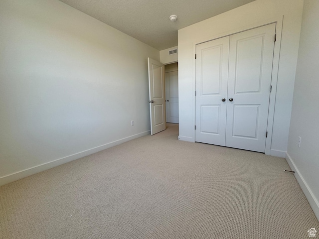 1650 N Main St N Unit 116, Layton, UT 84041 - unfurnished bedroom featuring light carpet and a closet
