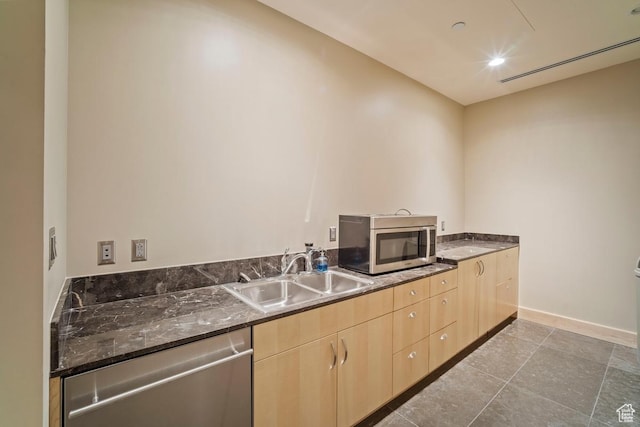 35 E 100 S Unit 708, Salt Lake City, UT 84111 - kitchen with appliances with stainless steel finishes, light brown cabinetry, dark stone counters, and recessed lighting