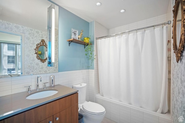 35 E 100 S Unit 708, Salt Lake City, UT 84111 - full bath featuring tile walls, vanity, shower / bath combo with shower curtain, and wainscoting
