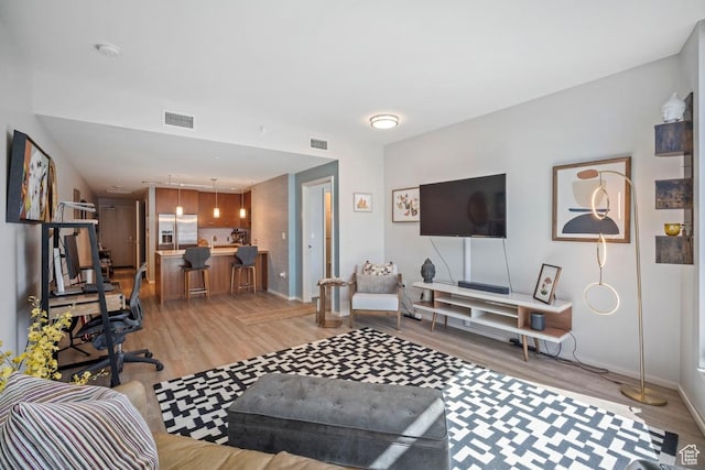 35 E 100 S Unit 708, Salt Lake City, UT 84111 - living area featuring light wood finished floors and baseboards