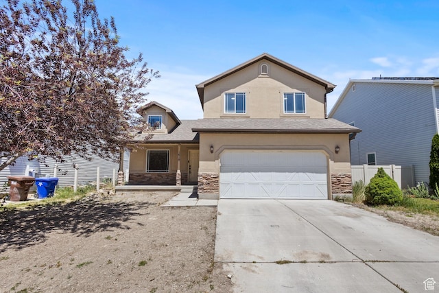 1919 E Church Way, Eagle Mountain, UT 84005 - traditional-style home with stone siding, driveway, an attached garage, and stucco siding