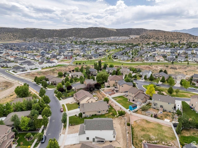 7625 N Silver Creek Way, Eagle Mountain, UT 84005 - aerial view of property's location with nearby suburban area and a mountainous background