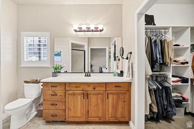 1065 W 2740 S, Nibley, UT 84321 - bathroom featuring vanity and a walk in closet