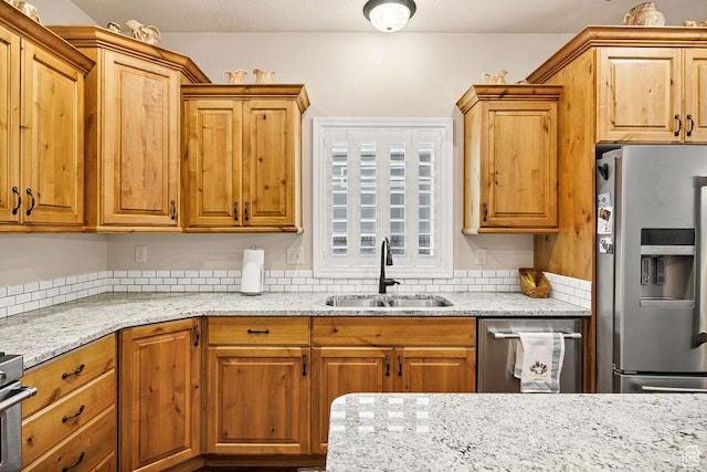 1065 W 2740 S, Nibley, UT 84321 - kitchen featuring stainless steel fridge, light stone countertops, and brown cabinetry