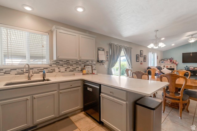 2714 E Stony Hill Way S, Spanish Fork, UT 84660 - kitchen with dishwashing machine, a peninsula, open floor plan, light tile patterned floors, and vaulted ceiling