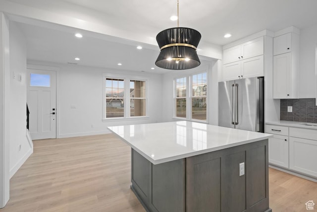 6658 W Docksider Dr, South Jordan, UT 84009 - kitchen with high quality fridge, plenty of natural light, white cabinetry, light countertops, and recessed lighting