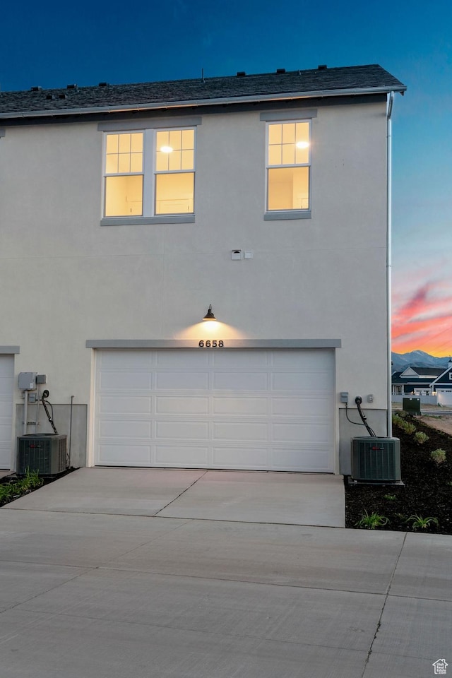 6658 W Docksider Dr, South Jordan, UT 84009 - view of front of house featuring a garage, stucco siding, and driveway