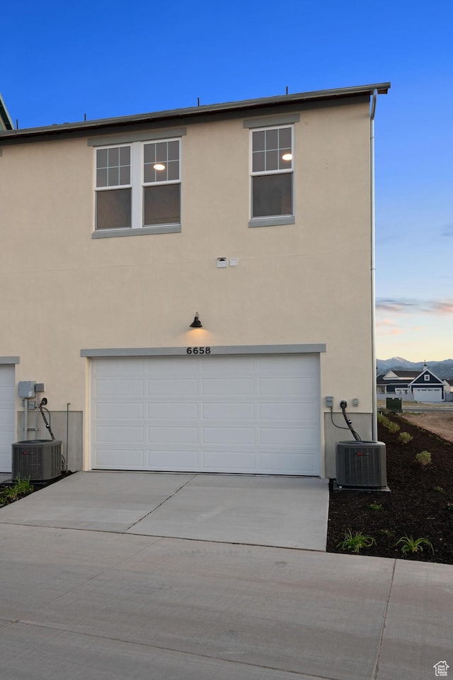 6658 W Docksider Dr, South Jordan, UT 84009 - view of front of house featuring a garage, stucco siding, and concrete driveway