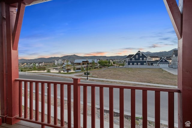 6658 W Docksider Dr, South Jordan, UT 84009 - yard at dusk with a balcony, a mountain view, and a residential view