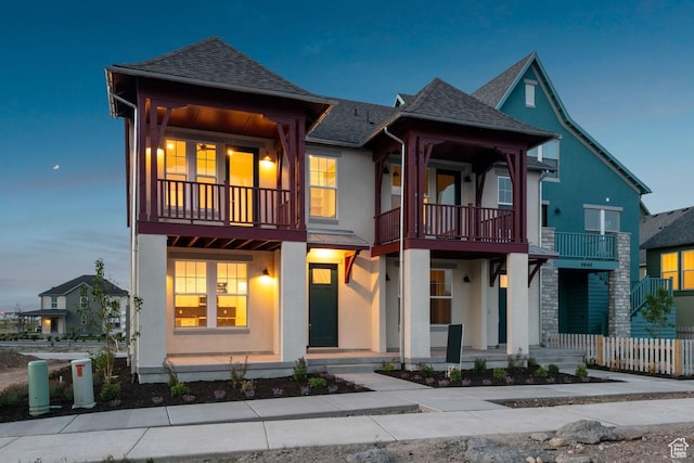 6658 W Docksider Dr, South Jordan, UT 84009 - view of front of home featuring a balcony, stucco siding, and a shingled roof