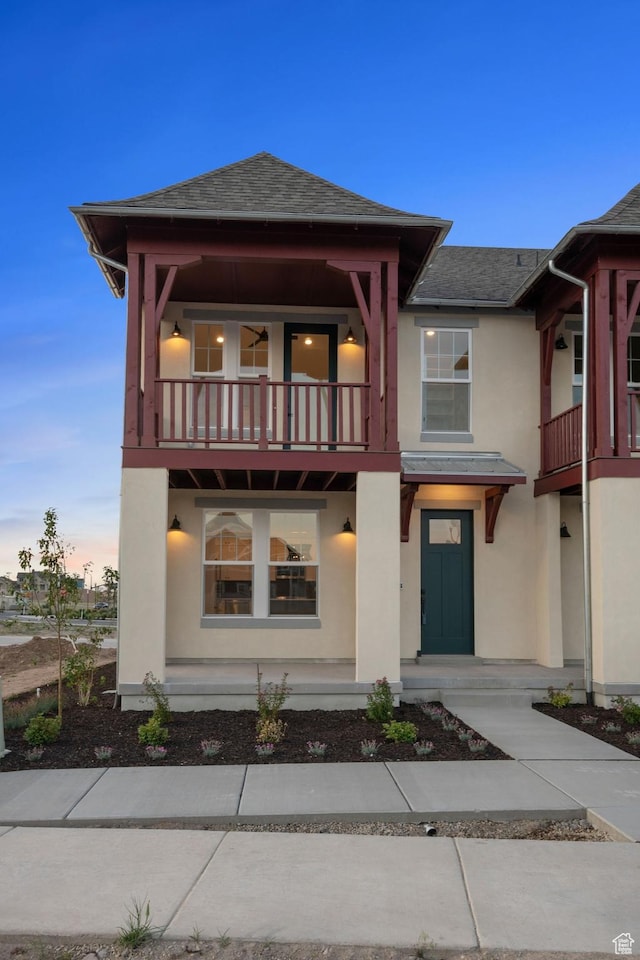 6658 W Docksider Dr, South Jordan, UT 84009 - view of front of property featuring a balcony, stucco siding, and a shingled roof
