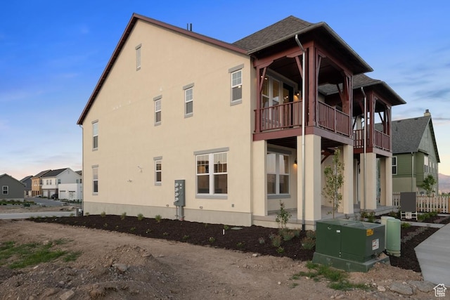 6658 W Docksider Dr, South Jordan, UT 84009 - view of side of property featuring stucco siding and a balcony