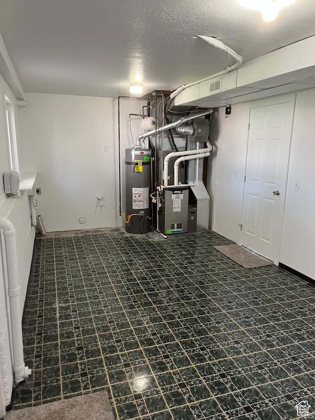 390 W 5050 S, Washington Terrace, UT 84405 - finished basement with secured water heater, a textured ceiling, and heating unit