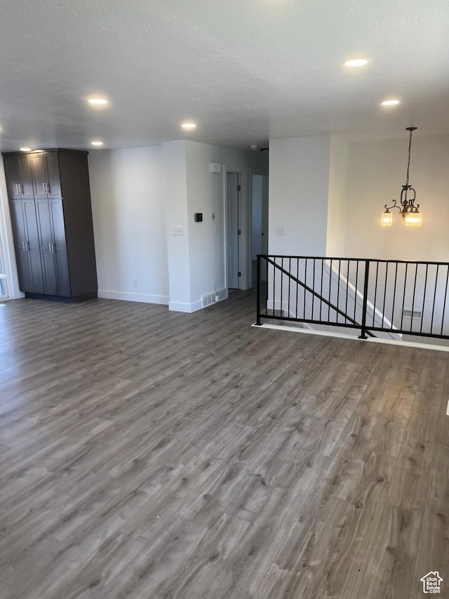 390 W 5050 S, Washington Terrace, UT 84405 - unfurnished room with wood finished floors, recessed lighting, a textured ceiling, and a chandelier