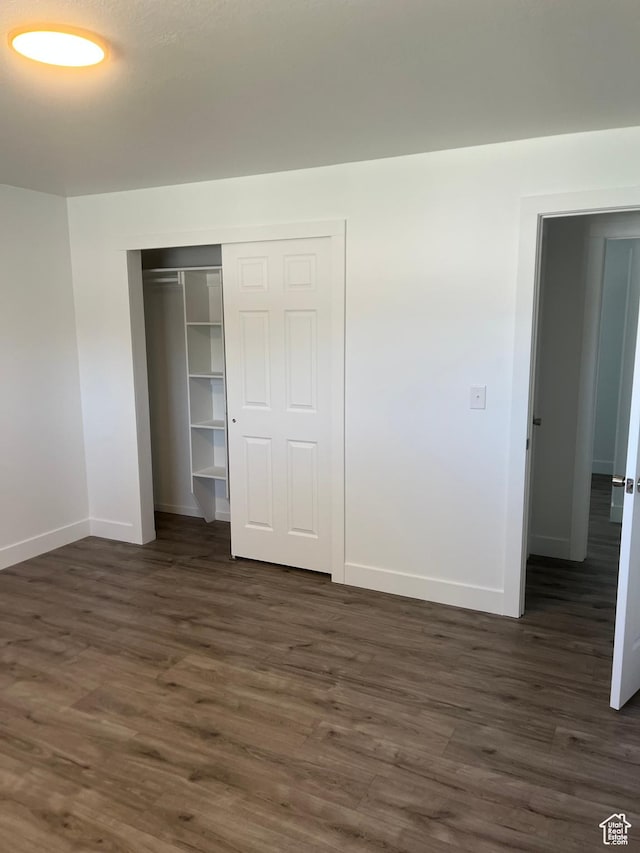 390 W 5050 S, Washington Terrace, UT 84405 - unfurnished bedroom featuring dark wood-style floors and a closet