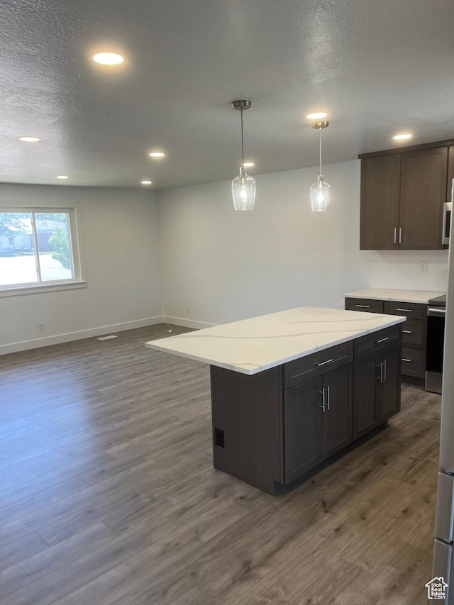 390 W 5050 S, Washington Terrace, UT 84405 - kitchen featuring dark wood-style flooring, recessed lighting, pendant lighting, a center island, and stove