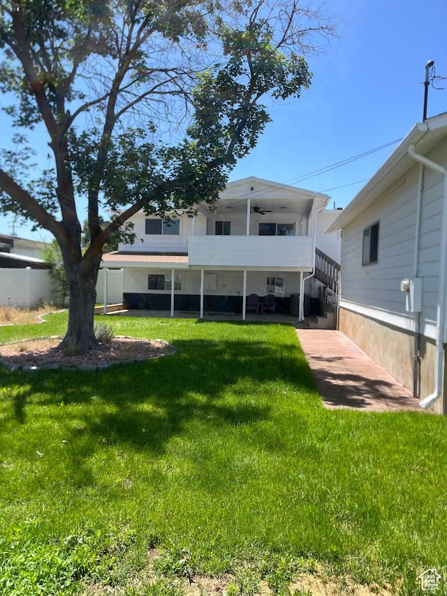 390 W 5050 S, Washington Terrace, UT 84405 - rear view of property with a ceiling fan and a yard